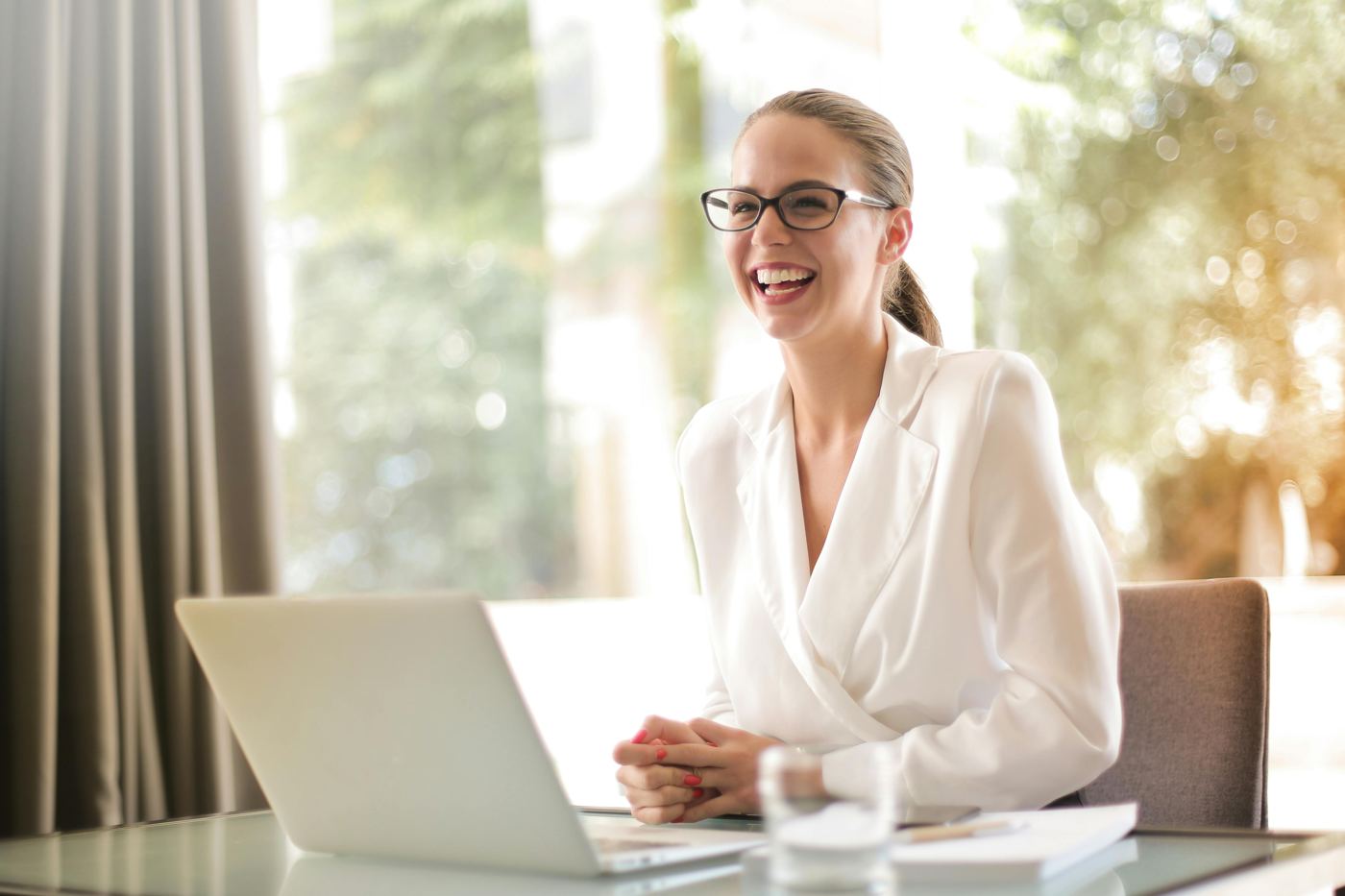 Attorney working with a client on a laptop